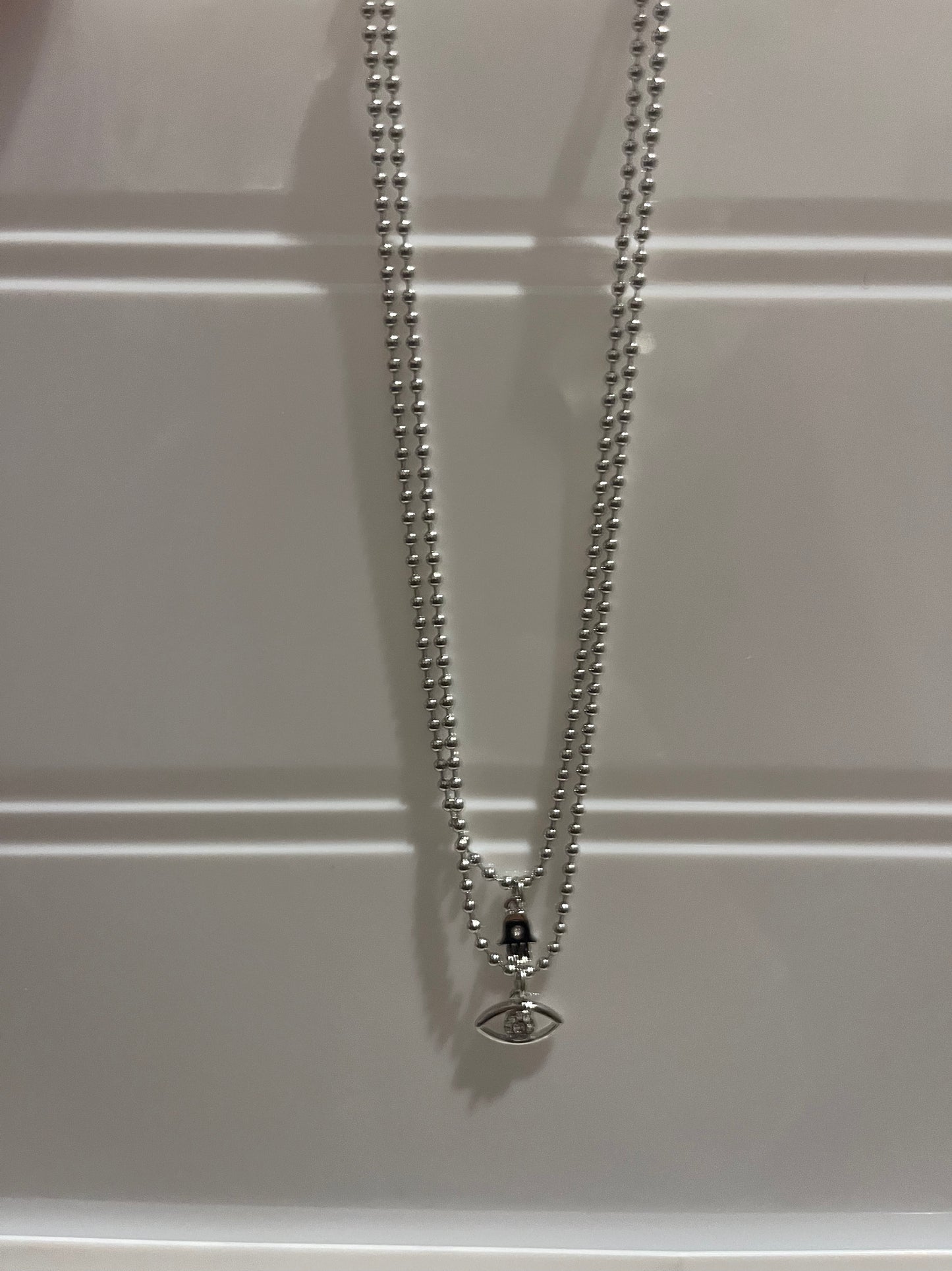 2 in 1 evil eye & hamsa hand necklaces