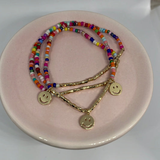 Colorful beaded bracelets with smiley face